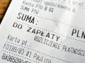 Paragon z NIP: suma do zapłaty PLN. Widoczna kwota PTU B 8%, suma PTU, rozliczenie płatności kartą.
